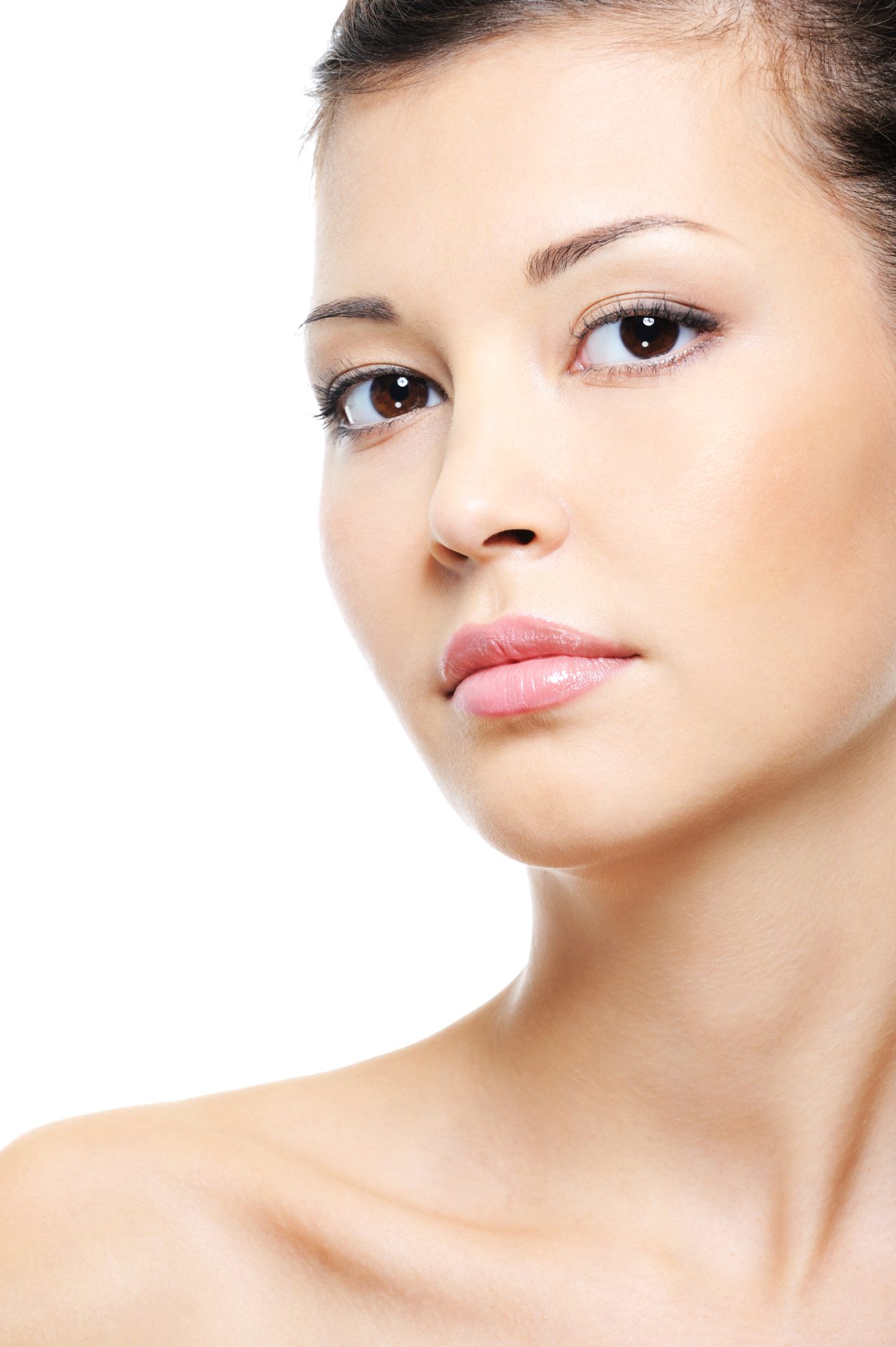 Close-up portrait of a attractive serene asian female face over white background