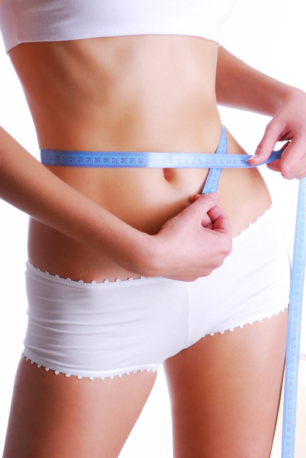 Woman measuring beauty slim waist. Health eating concept